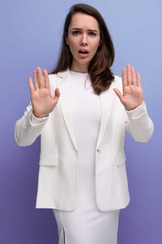 smart european pretty brunette young woman in dress and jacket.