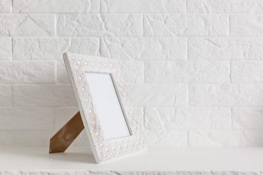 Square simple blank white photo frame on wall