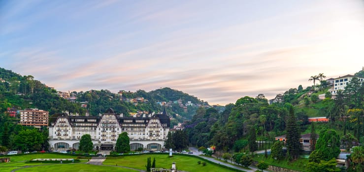 Long exposure abstract sky with blurry clouds over the famous Quitandinha Palace in Petropolis, Brazil.