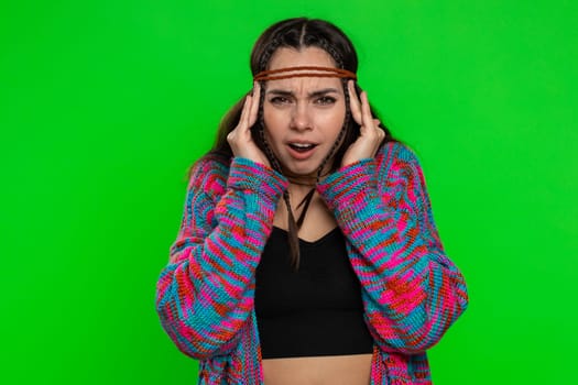 Pretty hippie woman rubbing temples to cure headache problem, suffering from tension, migaine, stress, grimacing in pain, high blood pressure isolated alone on chroma key background, green screen