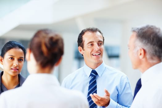 Successful people discussing business issues. Portrait of successful people discussing business issues