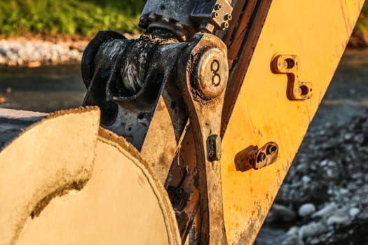 Detail of excavator (digger machine) bucket joint mechanism. Abstract image to illustrate construction.