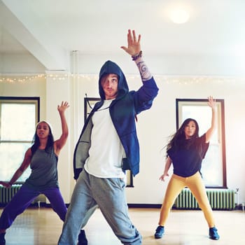 Rising dance stars. a group of young people dancing together in a studio