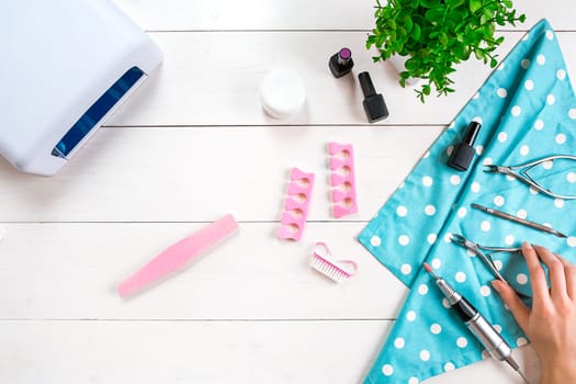 Nail care. Manicure set and nail polish on wooden background. Top view. Manicurist. Manicure for yourself