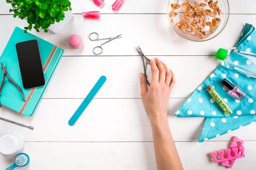 Nail care. Manicure set and nail polish on wooden background. Top view. Manicurist. Manicure for yourself