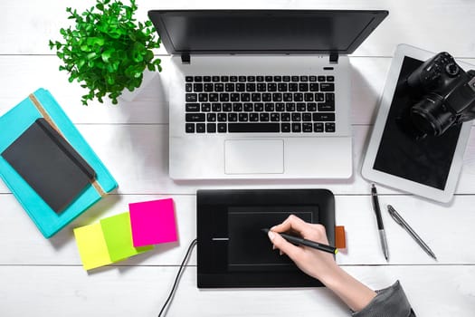 Laptop with blank screen and girl's hands. Flat lay, top view workspace. Copy space