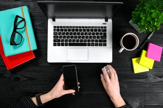 Overhead view of businesswoman working at computer in office. Place for your text. Ideal for blog. Flat lay