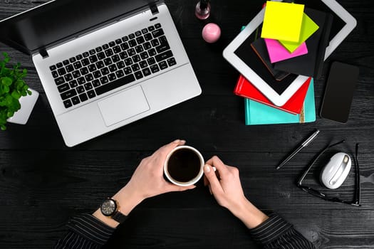 Overhead view of businesswoman working at computer in office. Place for your text. Ideal for blog. flat lay on black background