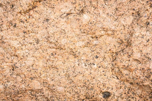 Detail of the marble wall texture, close-up of the rock surface.