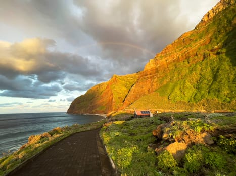 Achadas da cruz village stone path sunset view in Porto Moniz district, Madeira, Portugal