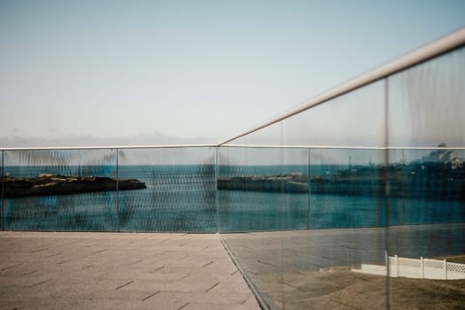 Panoramic view of the city. An observation deck with a figured fence and a lantern. City view.