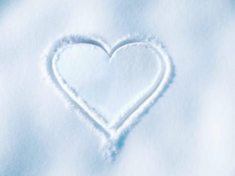 Heart, drawing and shape on ground in snow for love, romance and outdoor in winter for mockup space. Icon, emoji and romantic art, sign or creativity in ice, nature or frozen Valentines Day holiday.