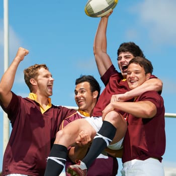 Winner, victory and rugby with a team in celebration together outdoor after a game or competition. Fitness, sports and energy with a winning man athlete group celebrating scoring a try or success.