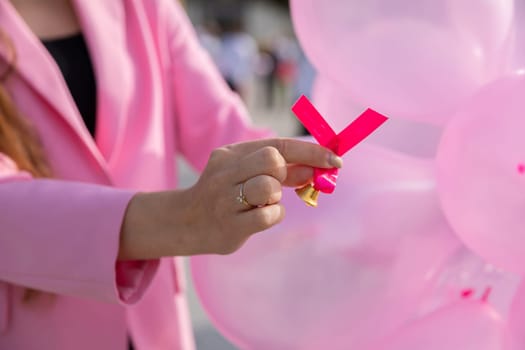 The pink ribbon symbolizes the promotion of periodic preventive breast examinations. The color pink as a symbol of the fight against breast cancer.