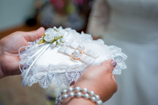 Two gold wedding rings and small flowers