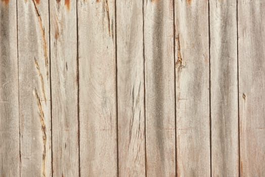 The texture of light wood planks vertical