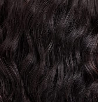 Beauty, hair care and closeup of a woman with healthy, wellness and healthcare of a hairstyle texture. Salon, curls and wavy haircut textures of a female with dark color beautician treatment.