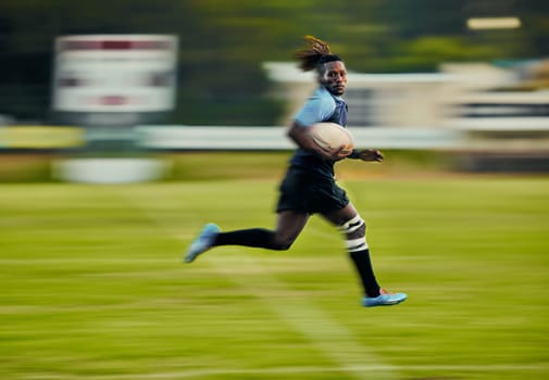 Rugby, action and black man running with ball to score goal on field at game, match or practice workout. Sports, fitness and motion, player on blurred background on grass with energy and sport skill