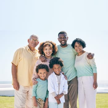 Smile, love and portrait of a happy family at a beach for travel, vacation and holiday on nature in summer. Relax, face and trip with children, parents and grandparents bond while traveling in Miami.