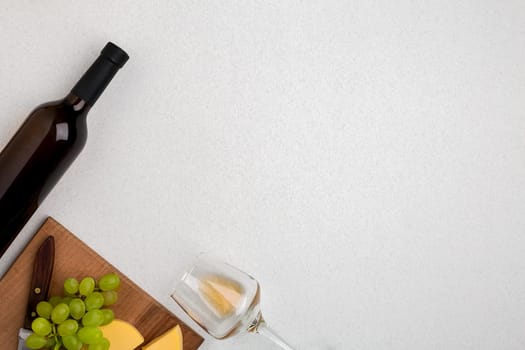 Wine, glasses and corkscrew over white background. Top view with copy space