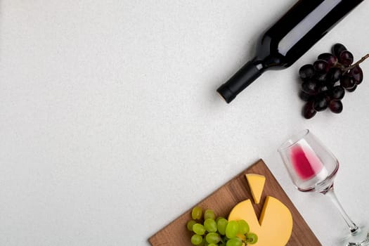 Wine, glasses and corkscrew over white background. Top view with copy space