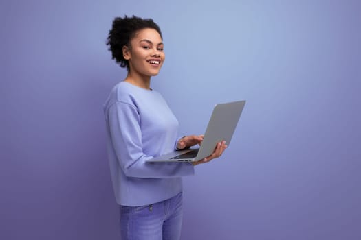 successful young afro hair brunette business woman working using laptop.