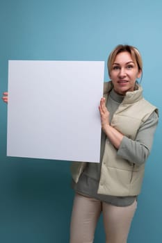 young blond hair woman demonstrating notice board with blank space.