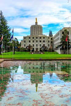 Oregon State Capitol building in Salem, Oregon, with reflection in the pool