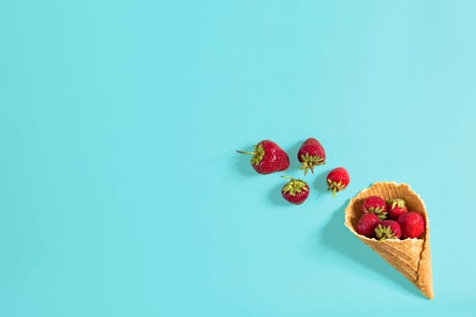 Fresh strawberry in waffle cone. Creative food concept. Flat lay, top view. Copy space. Still life mockup flat lay