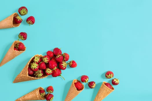 Fresh strawberry in waffle cones. Creative food concept. Flat lay, top view. Copy space. Still life mockup flat lay