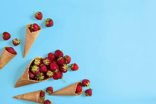 Strawberry in a waffle cone. Top view. Copy space. Flat lay
