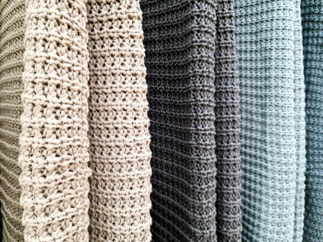 Detailed close up view on samples of cloth and fabrics in different colors found at a fabrics market.