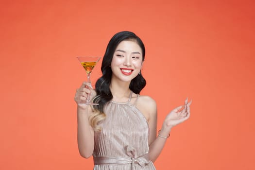 young asian woman with a glass of white wine