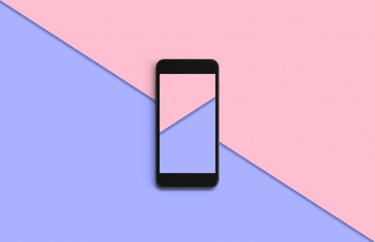Phone with colorful screen on top view, background in pastel colors. Copy space