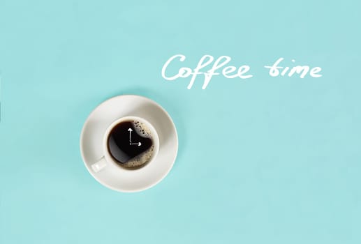 Top view of cup of black coffee and Coffee time lettering isolated on blue background. Still life. Mock up. Flat lay