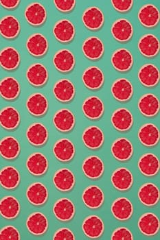 Grapefruit pattern isolated on blue background. Flat lay. Print