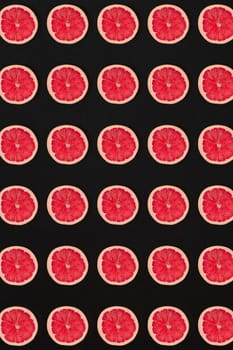 Grapefruit pattern isolated on black background. Flat lay. Print