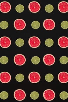 Grapefruit and lemon pattern isolated on black background. Flat lay. Print