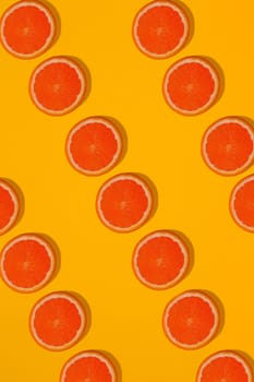 Grapefruit pattern on yellow background. Minimal flat lay concept. Print