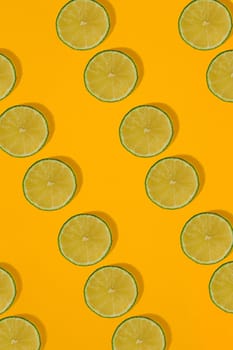 Lime pattern on yellow background. Minimal flat lay concept. Print