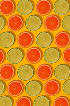 Grapefruit and lime pattern on yellow background. Minimal flat lay concept. Print