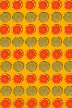 Grapefruit and lime pattern on yellow background. Minimal flat lay concept. Print