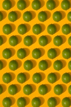 Lime pattern on yellow background. Minimal flat lay concept. Print