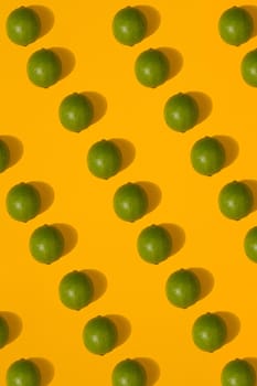 Lime pattern on yellow background. Minimal flat lay concept. Print