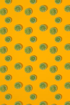 Lime pattern on yellow background. Minimal flat lay concept. Print