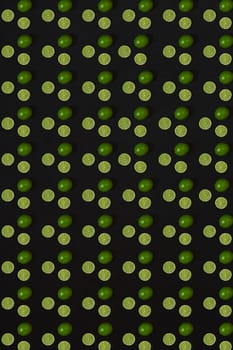 Lime pattern on black background. Minimal flat lay concept. Print