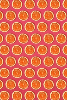 Grapefruit pattern on pink background. Minimal flat lay concept. Print