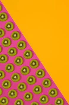 Fruit citrus seamless pattern. Kiwi tile texture. Pink and yellow background
