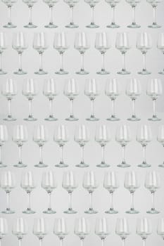 Seamless pattern - glasses over white background. Empty wine glass