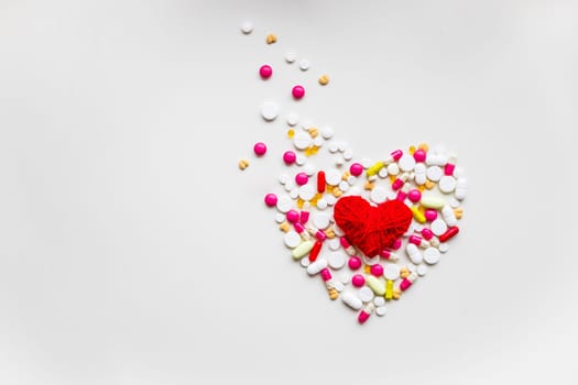 Assorted pharmaceutical medicine pills, tablets and capsules for the treatment of heart disease.